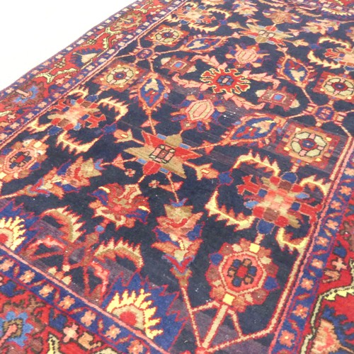 767 - Tribal rugs; a hand-knotted Persian Borujerd rug, dark blue-ground woven in traditional geometric pa... 