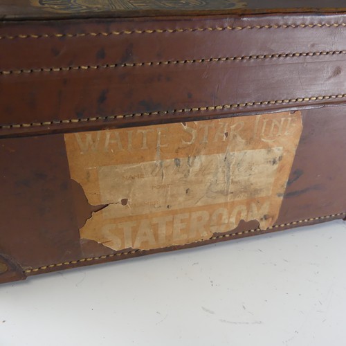 739 - A vintage leather Suitcase, with maker's label for 'Natal Trunk Works Ltd, Manufacturers, Durban', a... 