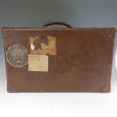 739 - A vintage leather Suitcase, with maker's label for 'Natal Trunk Works Ltd, Manufacturers, Durban', a... 