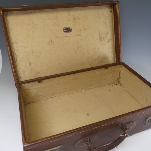 739 - A vintage leather Suitcase, with maker's label for 'Natal Trunk Works Ltd, Manufacturers, Durban', a... 