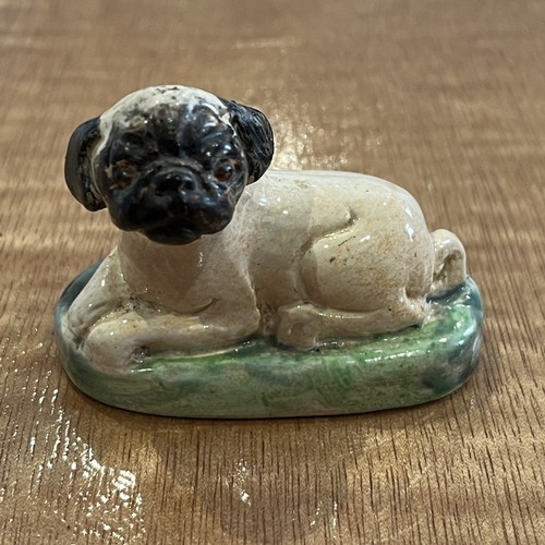 10 - An 18thC Staffordshire slipware Money Box, in the form of a seated dog, with repair to head, H 11cm,... 