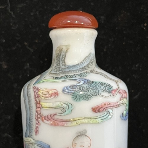 105 - A Chinese famille rose porcelain Snuff Bottle, decorated in fine enamels of an elder riding a dragon... 