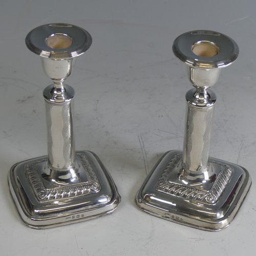 21 - A pair of Edwardian silver Candlesticks, by Ellis & Co., hallmarked Birmingham 1907, with weight... 