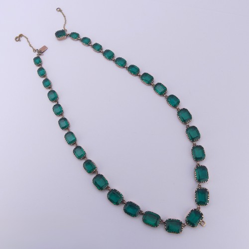  A 19thC green paste rivière Necklace, the graduated cushion shaped emerald green stones in a scallop... 