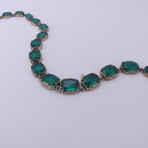  A 19thC green paste rivière Necklace, the graduated cushion shaped emerald green stones in a scallop... 