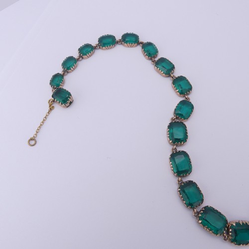  A 19thC green paste rivière Necklace, the graduated cushion shaped emerald green stones in a scallop... 