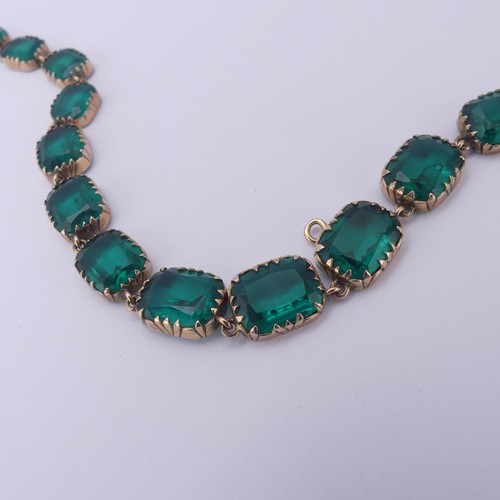  A 19thC green paste rivière Necklace, the graduated cushion shaped emerald green stones in a scallop... 