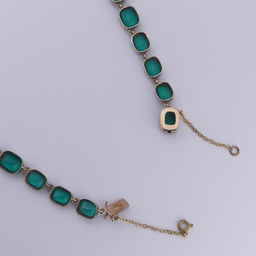  A 19thC green paste rivière Necklace, the graduated cushion shaped emerald green stones in a scallop... 