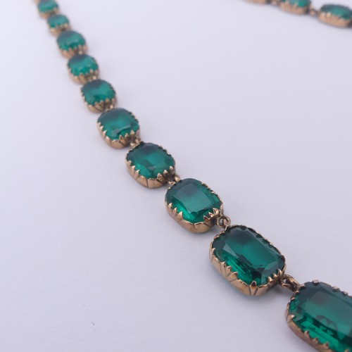  A 19thC green paste rivière Necklace, the graduated cushion shaped emerald green stones in a scallop... 