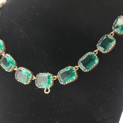  A 19thC green paste rivière Necklace, the graduated cushion shaped emerald green stones in a scallop... 