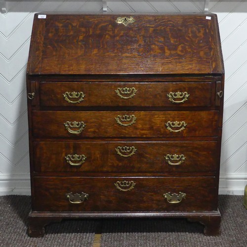 A George III oak Bureau, the sloped fall front concealing a fitted interior and writing surface, above four long graduating drawers, raised on bracket feet, W 94 cm x H 107 cm x D 52.5 cm.