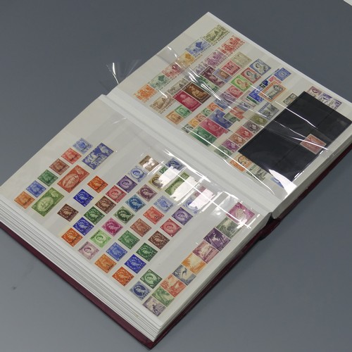  Stamps; A mainly unmounted mint selection of KGV to early QEII Stamps, in a stockbook with sets incl... 