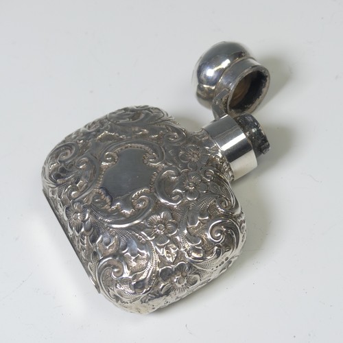 46 - A Victorian silver Scent Bottle / Flask, hallmarked Birmingham 1889, makers mark 'L.G', of shaped re... 