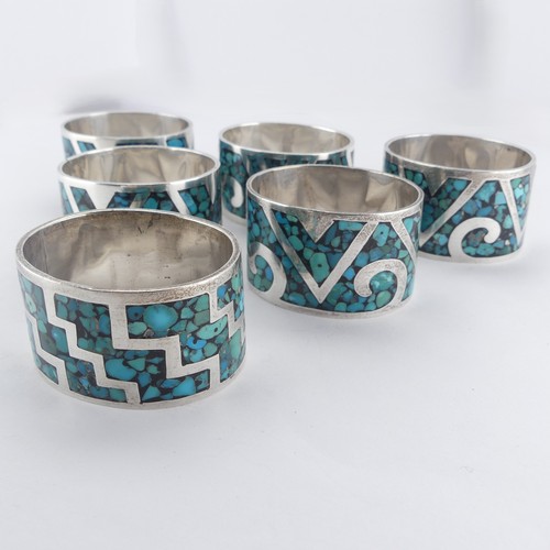 64 - A set of six Mexican silver Napkin Rings, inset with turquoise, marked 'TZ-09 925 Mexico', approx. t... 