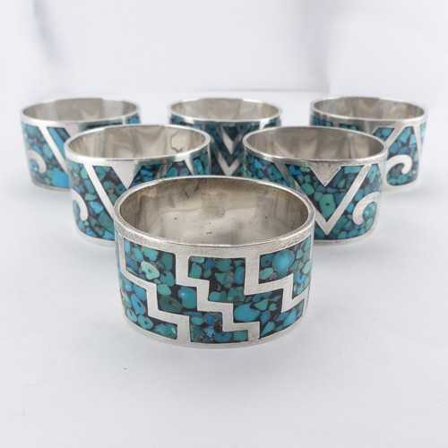 64 - A set of six Mexican silver Napkin Rings, inset with turquoise, marked 'TZ-09 925 Mexico', approx. t... 