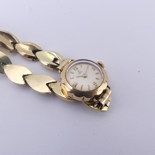 139 - A 9ct yellow gold lady's Ebel Wristwatch, manual wind movement, on 9ct gold bracelet strap, gross to... 