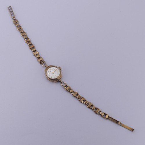 140 - A 9ct yellow gold lady's Tudor Wristwatch, the signed silvered dial with gilt baton markers, Tudor 1... 