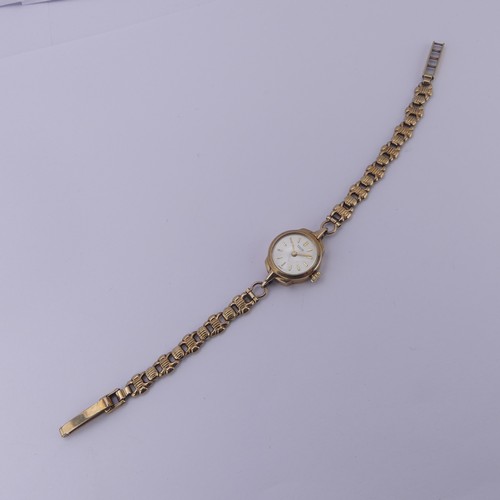 140 - A 9ct yellow gold lady's Tudor Wristwatch, the signed silvered dial with gilt baton markers, Tudor 1... 