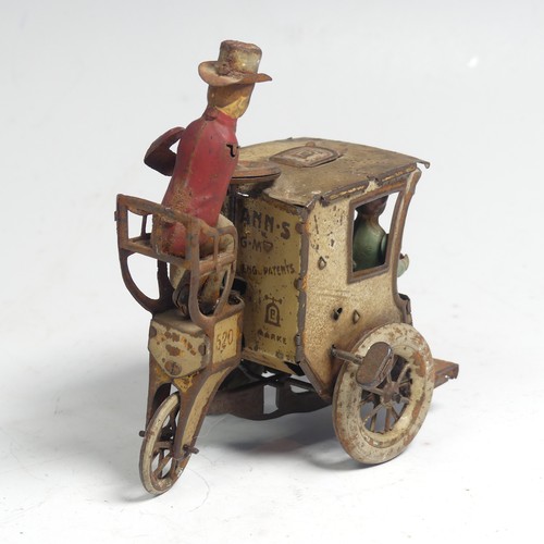 3 - A Lehmann tinplate clockwork Carriage, No. 520, the mechanism giving movement to the two seated figu... 
