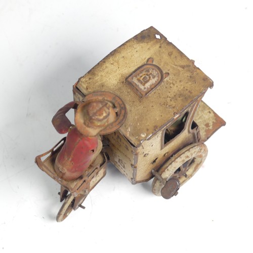 3 - A Lehmann tinplate clockwork Carriage, No. 520, the mechanism giving movement to the two seated figu... 