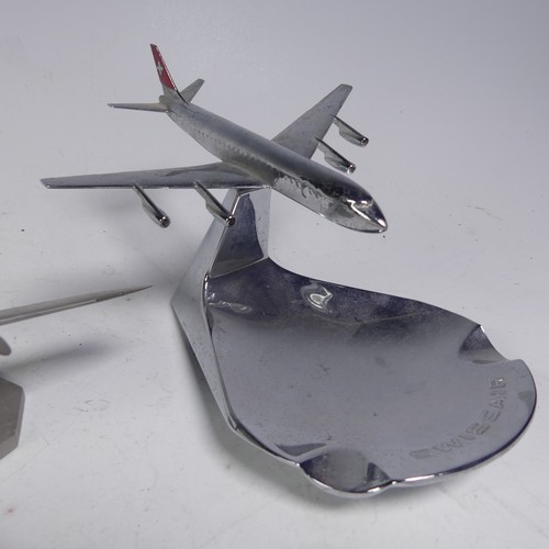 20 - A Swiss Air chromed cast metal desktop display Ashtray, the aircraft mounted on a pivotal stand, mad... 