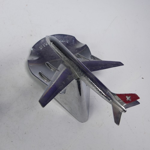 20 - A Swiss Air chromed cast metal desktop display Ashtray, the aircraft mounted on a pivotal stand, mad... 