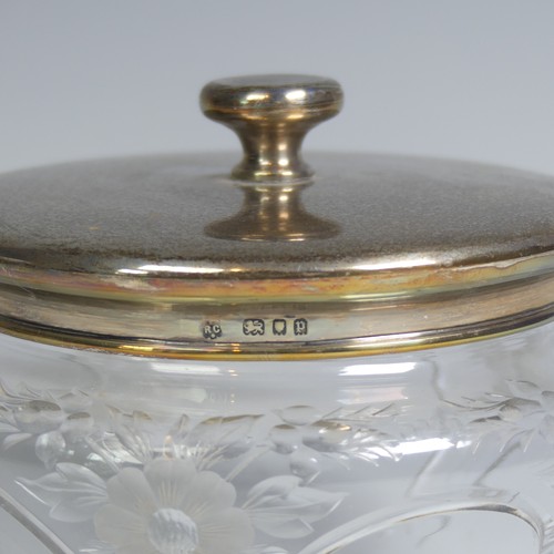 9 - A George V silver mounted glass Dressing Table Jar, by William Comyns & Sons Ltd., hallmarked Lo... 