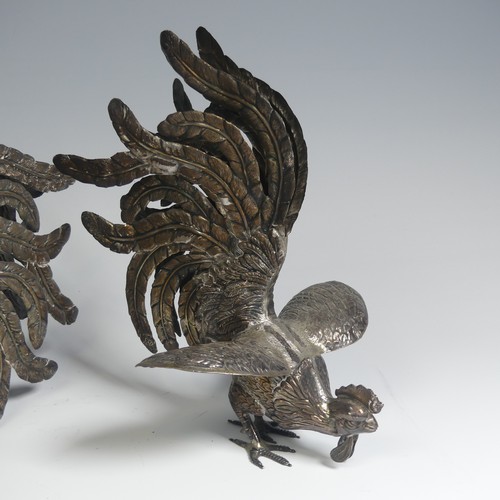 11 - A pair of Peruvian 925 silver Fighting Cocks, naturalistically modelled, the feet marked 'Plata 925 ... 
