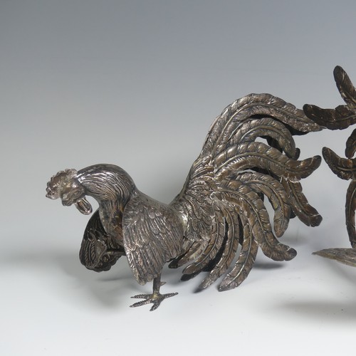 11 - A pair of Peruvian 925 silver Fighting Cocks, naturalistically modelled, the feet marked 'Plata 925 ... 