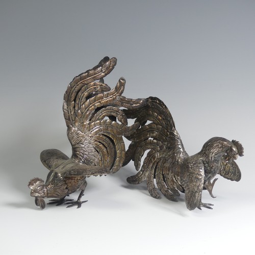 11 - A pair of Peruvian 925 silver Fighting Cocks, naturalistically modelled, the feet marked 'Plata 925 ... 