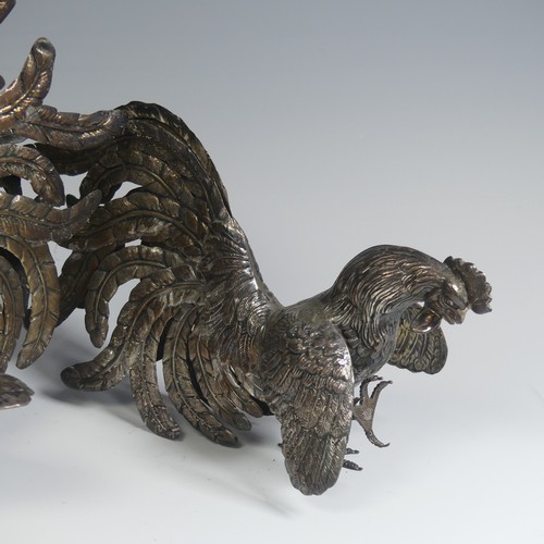 11 - A pair of Peruvian 925 silver Fighting Cocks, naturalistically modelled, the feet marked 'Plata 925 ... 
