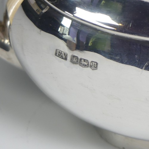 16 - A George V silver three piece Tea Set, by Viner's Ltd., hallmarked Sheffield 1933/4, of plain oval f... 