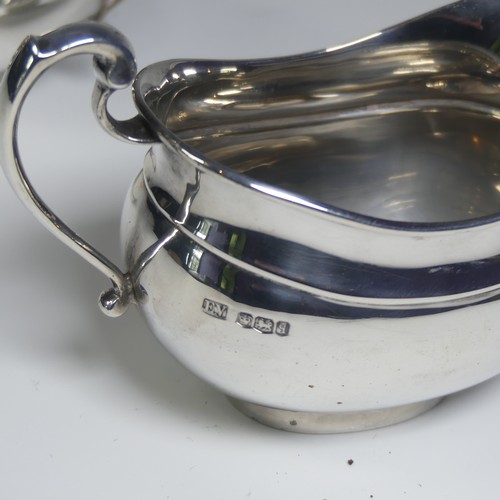 16 - A George V silver three piece Tea Set, by Viner's Ltd., hallmarked Sheffield 1933/4, of plain oval f... 