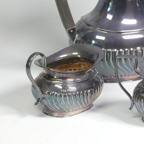 45 - A matched Elizabeth II silver four piece Tea Set, the tea pot, coffee pot and milk jug marked for th... 