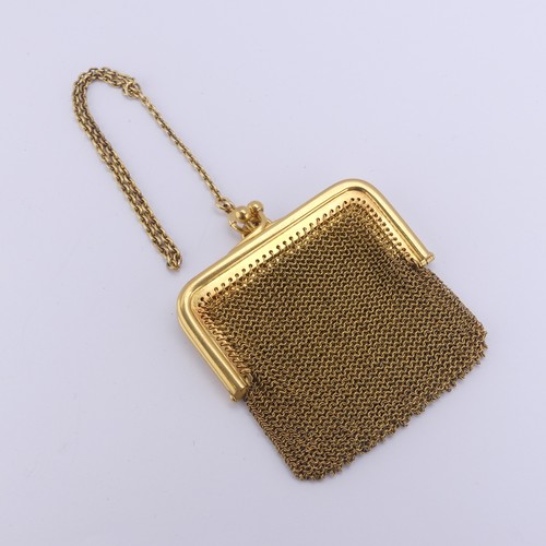 An early 20thC Continental 15ct gold mesh Coin Purse, with cross over ball snap, the two part interior initialled on the hinged divider, the frame 6.4cm wide, with central suspension loop and a 15ct gold oval link carry chain, the bolt ring marked 15, approx. total weight 56.4g.