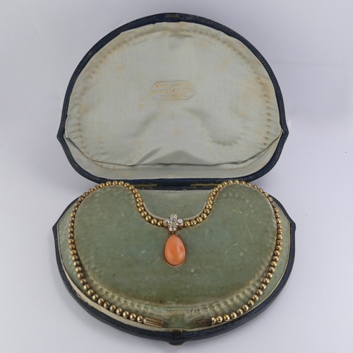 251 - An Edwardian pink coral and diamond Necklace, the pear shaped coral drop with cushion cut diamond cl... 
