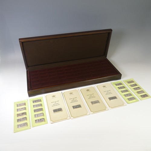 '1000 Years of British Monarchy'; A set of fifty silver Ingots, issued by John Pinches, hallmarked London 1973, most in individual carded blister packs as issued, three packs as a group of five, one loose, together with a wooden presentation case, unused, accompanying booklet but lacking certificate, approx. total weight 3300g.