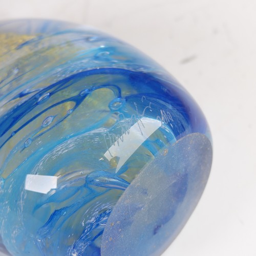 32 - Peter Layton (b. 1937) a studio glass Paperweight, of bullet shape, with light blue swirl and golden... 