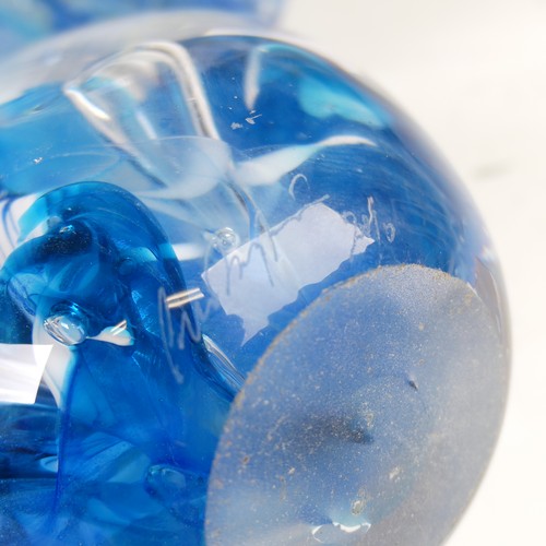 32 - Peter Layton (b. 1937) a studio glass Paperweight, of bullet shape, with light blue swirl and golden... 