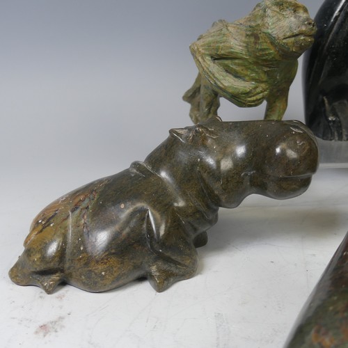 23 - An African stone carving of a Hippopotamus, possibly from Zimbabwe, unsigned, L 17 cm, together with... 
