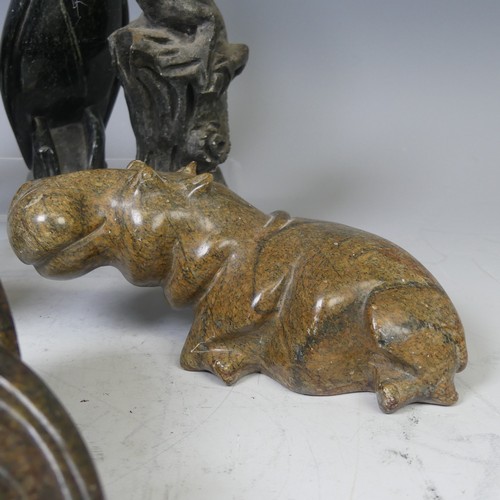 23 - An African stone carving of a Hippopotamus, possibly from Zimbabwe, unsigned, L 17 cm, together with... 