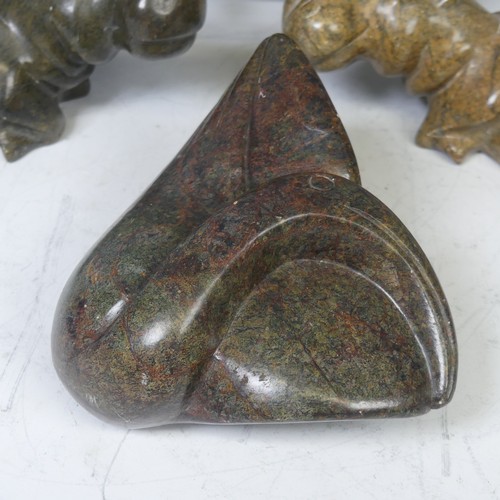 23 - An African stone carving of a Hippopotamus, possibly from Zimbabwe, unsigned, L 17 cm, together with... 