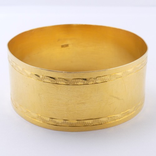 272 - An Egyptian 21ct yellow gold Bangle, 30mm wide, internal diameter approx. 68mm with some distortions...