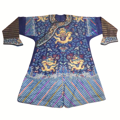 232 - A 19th century Chinese blue silk embroidered dragon robe, late Qing dynasty, finely worked in colour...