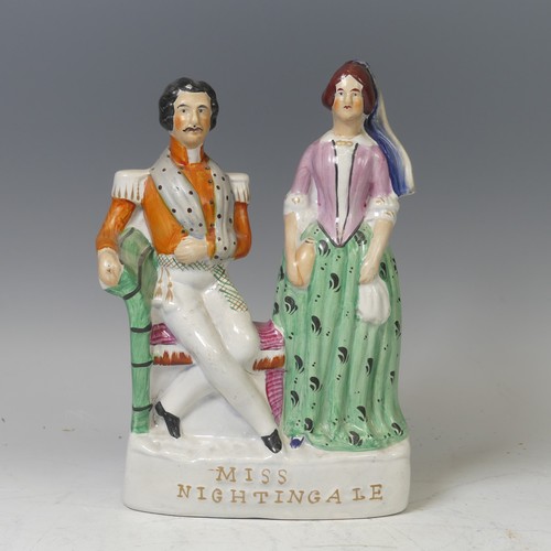 41 - A mid-19th century Staffordshire pottery flatback figural group, Miss Nightingale, circa 1855, model... 
