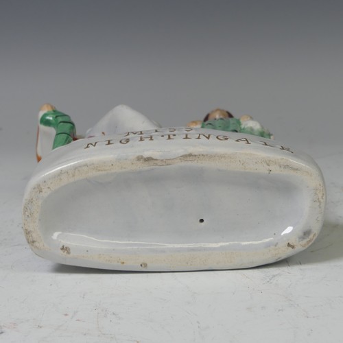 41 - A mid-19th century Staffordshire pottery flatback figural group, Miss Nightingale, circa 1855, model... 