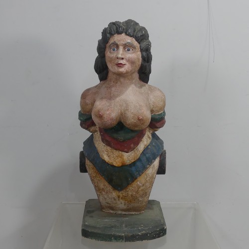 A carved wood Ship's gesso and polychrome painted Figurehead, in the form of a semi-nude woman, with iron hoop and label to the reverse and raised on plinth, W 35 cm x H 84 cm x D 48 cm.