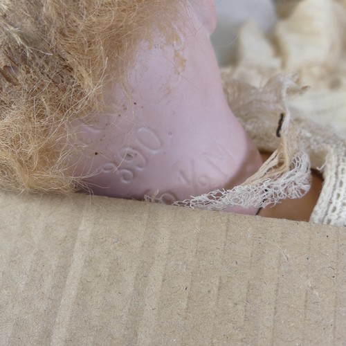 59 - An Armand Marseille bisque china head Doll, with brown glass sleeping eyes, open mouth and teeth, on... 