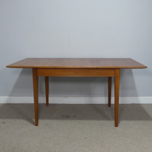 34 - A Mid 20th century Gordon Russell of Broadway teak extending dining Table, raised on tapering suppor... 