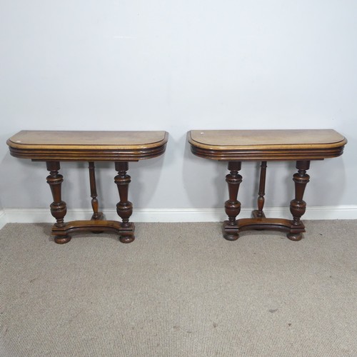 29 - A pair of Victorian mahogany console Tables, the rounded tops raised on turned supports and concave ... 